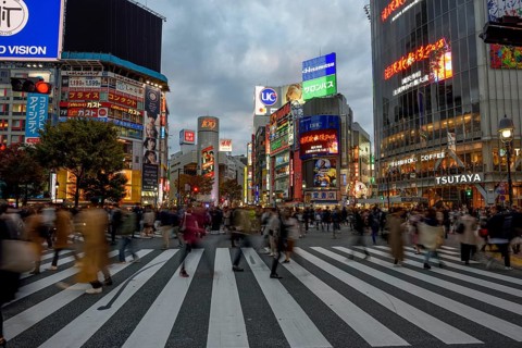 People cross the Shibuya crossroads, most frequented crossroads in the world, Shibuya, Tokyo,