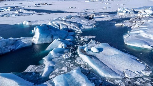 Aerial drone view of floating icebergs in Jokulsarlon glacier lagoon in Iceland