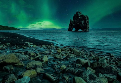 Hvitserkur landscape at night with beautiful Northern Lights. Iceland