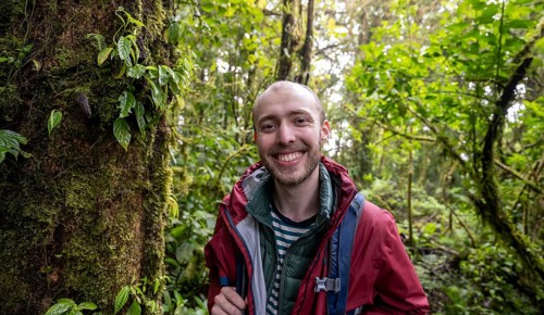 Young man in the rainforest, Monteverde cloud forest, Monte Verde, Puntarenas province, Costa Rica,
