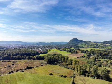 View over the Hausener Aachried to the Hegau volcano Hohentwiel with the town of Singen, Constance
