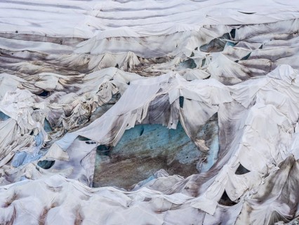 Rhone glacier covered with sheets to protect the ice from melting above the glacier cave,