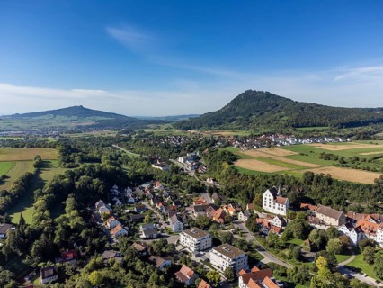 Aerial view of the town of Engen, on the right the Hegau volcano Hohenhewen. on the left the
