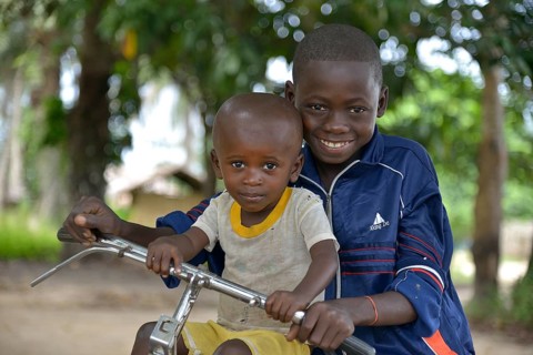 Two children with a bicycle, Nkala, Bandundu Province, Democratic Republic of the Congo