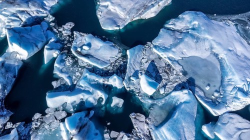 Aerial drone view of floating icebergs in Jokulsarlon glacier lagoon in Iceland, top view
