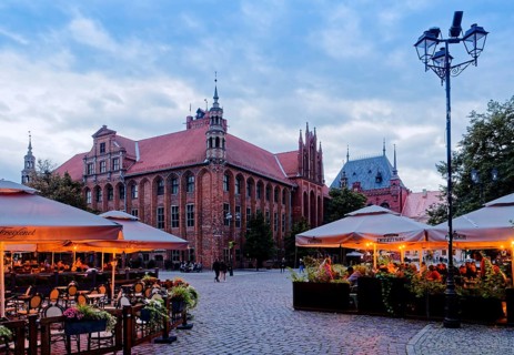 The lights come on in the restaurants in Panni Marii Street in the historic centre of Thorn in the