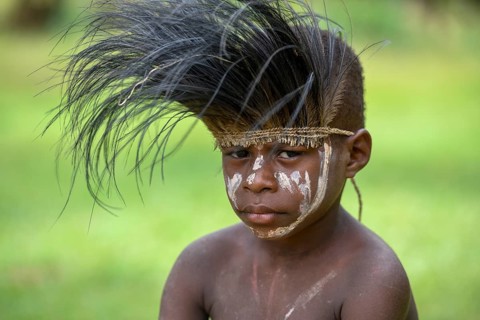 Native boy with cassowary feather headdress, village of Mutin, Lake Murray, Western Province, Papua