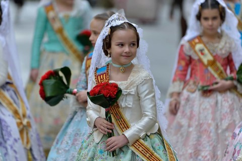 Fallas festival, girls in a traditional costume during the parade in the Plaza de la Virgen de los