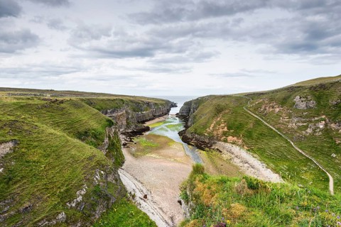 View from the viewpoint above Smoo Cave into the almost 800m long fjord Geodha Smoo, Durness,
