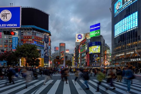 People cross the Shibuya crossroads, most frequented crossroads in the world, Shibuya, Tokyo,