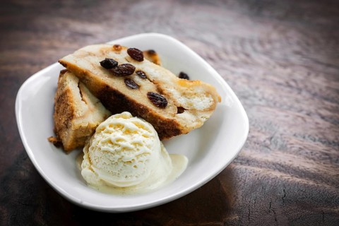 British traditional bread pudding with vanilla ice cream dessert