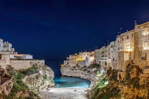 The Llama Monachile bay in Polignano a Mare in Apulia, Italy, at night, Europe