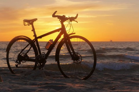 The silhouette of a Bicycle on the beach, Bicycle at sunset