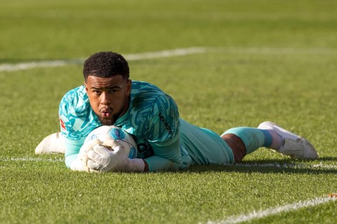 Football match, Noah ATUBOLU SC Freiburg safely holds the ball lying on the ground, Voith-Arena