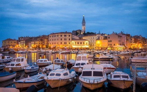 View of Rovinj in Croatia with boats at the port