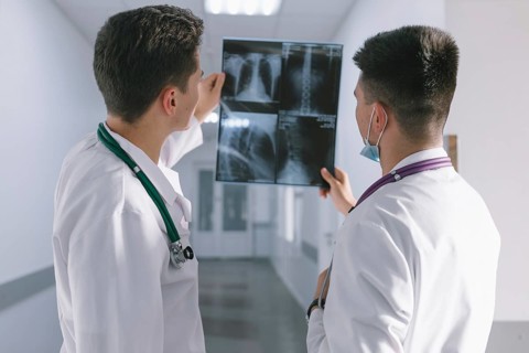 Two male doctors looking x ray. High resolution photo
