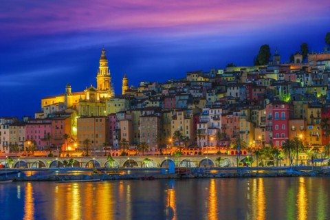 Old town architecture of Menton on French Riviera by night