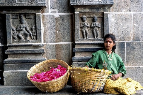 A girl selling flowers passageway of east gopuram in Thillai Nataraja temple in Chidambaram, Tamil