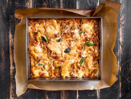 Top view of a delicious traditional italian lasagna made with minced beef bolognese sauce topped