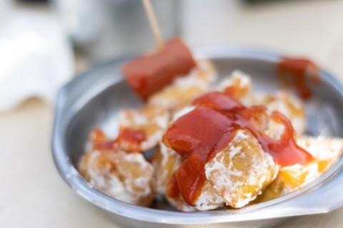 Close up of Spanish potatoes patatas bravas for tapas with tomato, mayonnaise and spicy sauce