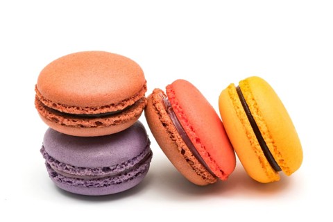 Colorful fresh macarons isolated on white background