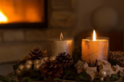 Burning candle on an Advent wreath