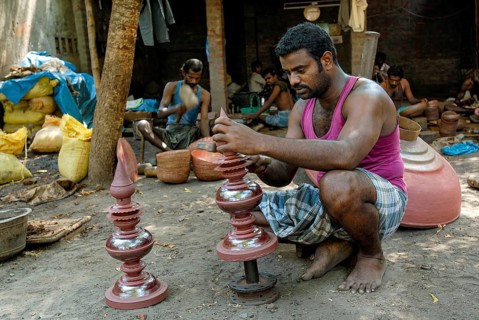 Engraver making copper gopura kalasam in Kumbakonam, Tamil Nadu, India, Asia