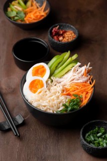 High angle traditional asian noodles with eggs vegetables