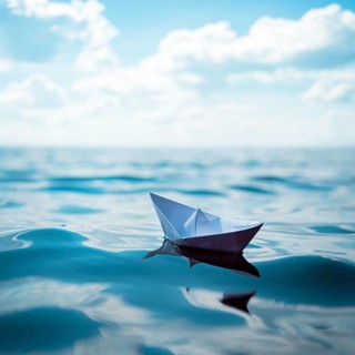 Paper ship at sea
