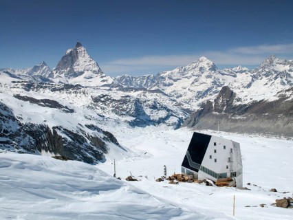 view of the Monte Rosa mountain hut and Gorner Glacier with the Matterhorn behind in the Valais