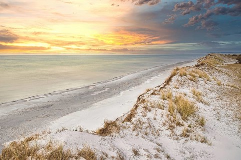 Dramatic sunset at the high dune on the darss. Viewpoint in the national park. Beach, Baltic Sea,