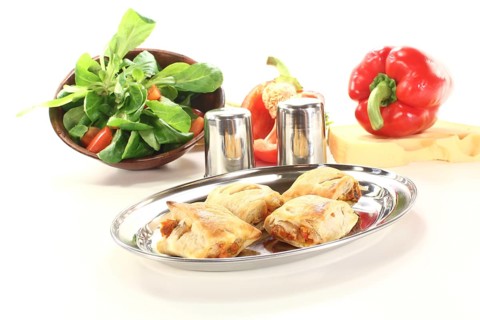 Puff pastry pockets with peppers and cheese against a light background