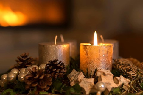 Burning candle on an Advent wreath