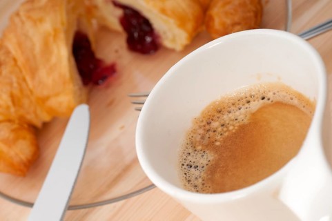 Fresh croissant french brioche and coffee typical traditional Italian breakfast