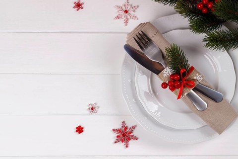 Christmas table setting on white wooden table.Christmas card template