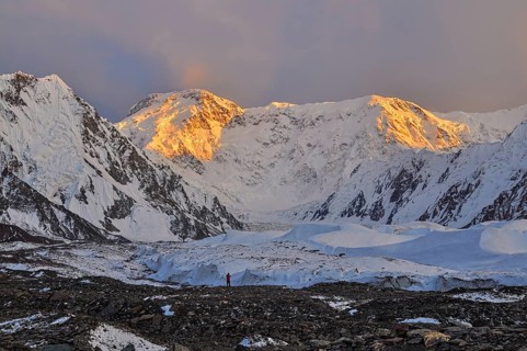 Inylcheck glacier in Kyrgyzstan with Pik Pobeda peak lit by early morning sun