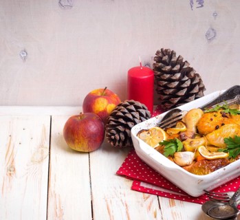Roasted chicken. Christmas food. Celebration white wooden table with roasted chicken, apples,