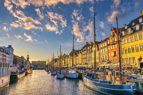 Copenhagen Denmark, sunset city skyline at Nyhavn harbour with colourful house