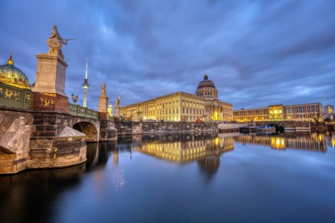The rebuilt Berlin City Palace with the TV Tower at dusk
