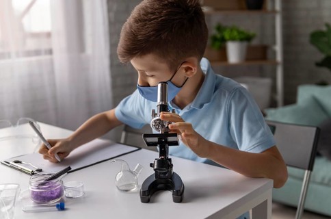 Medium shot kid learning with microscope