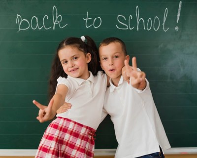 Cheerful boy girl blackboard