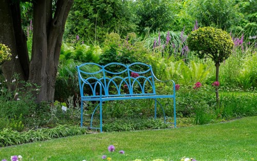 Blue bench in the district educational garden, Burgsteinfurt, Münsterland, North Rhine-Westphalia,