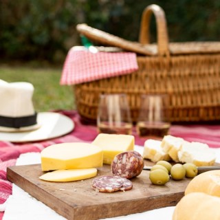 Wooden board with picnic goodies