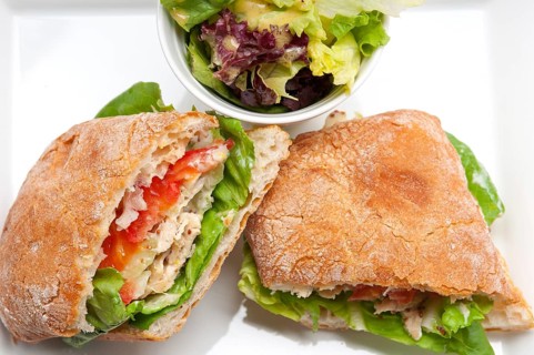 Italian ciabatta panini sandwich with chicken and tomato