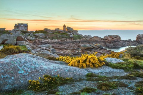 Rock formation and lonely house on the Cote de Granit Rose, Brittany, France, Europe