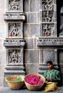 A girl selling flowers passageway of east gopuram in Thillai Nataraja temple in Chidambaram, Tamil