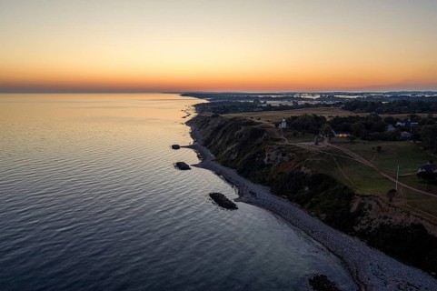 Hundested, Denmark, August 15, 2020: Aerial drone view of Spodsbjerg lighthouse and the coastline