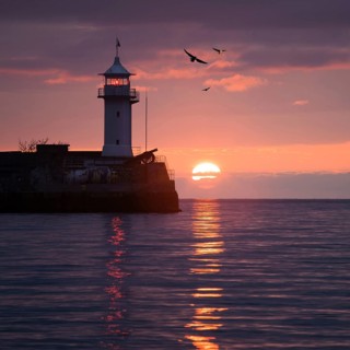 Lighthouse on sunrise. Yalta, Crimea, Ukraine, Europe
