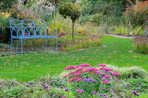 Blue bench in the district educational garden, Burgsteinfurt, Münsterland, North Rhine-Westphalia,