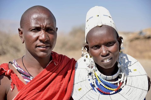 Maasai man and a woman wearing traditional dress, Ngorongoro Conservation Area, Ndema, Tanzania,